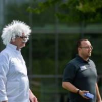 A staff member dressed like Einstein looks on during the tournament